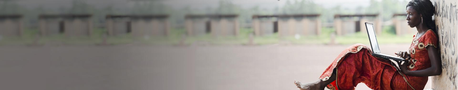 Woman in red on laptop